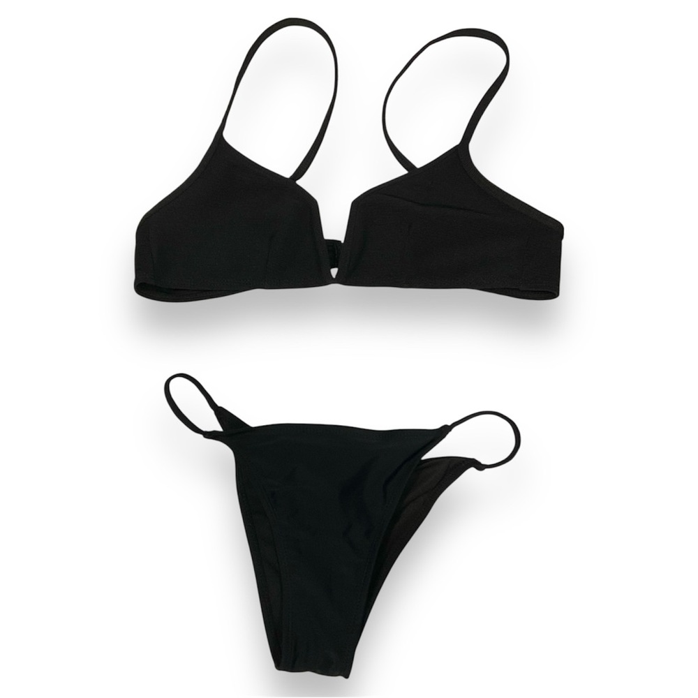 Mismatched black swimsuit pieces